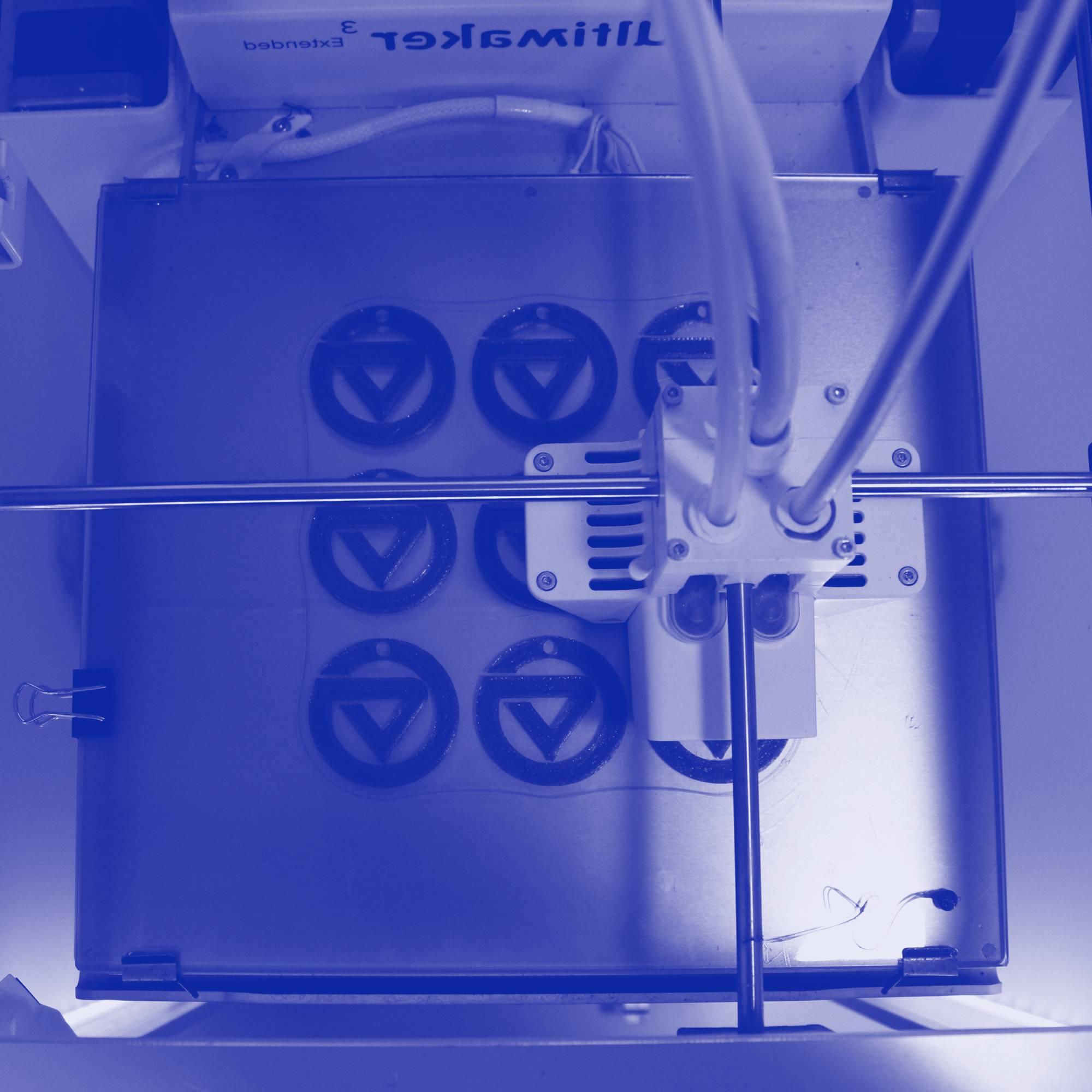 A 3D printer printing GVSU logos
